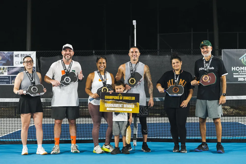 Mixed doubles champions at a Dink Club pickleball tournament in Miami