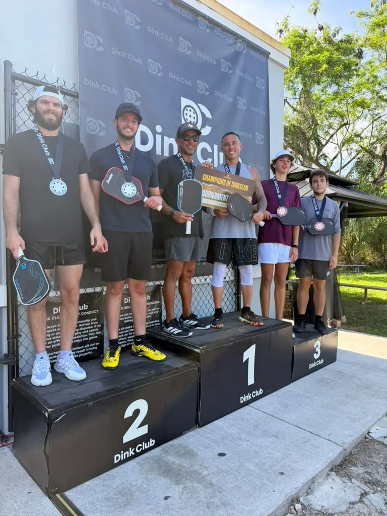 Dink Club league and tournament players with medals on the courts in Miami